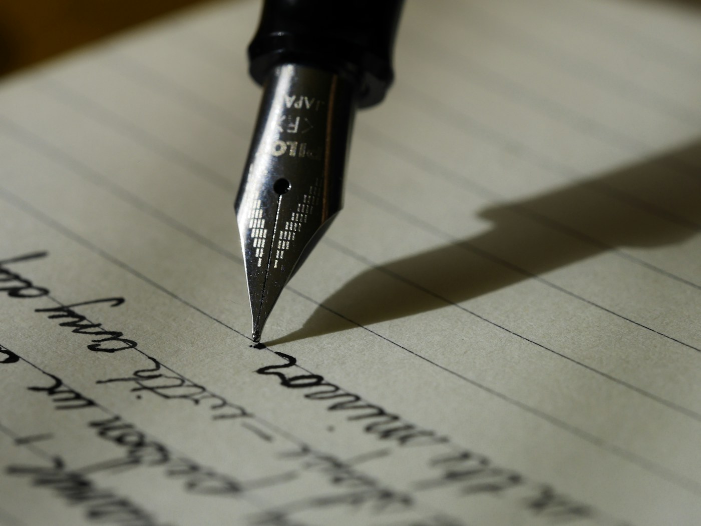 Person drafting an opportunity brief in a notebook